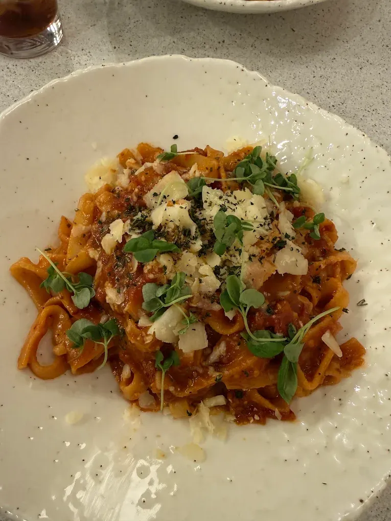 Classic Bolognese meat sauce over fresh pasta at Aglio Calgary